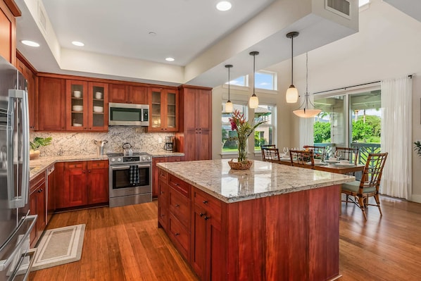 Fully-stocked kitchen minus food. High-end Bosch appliances