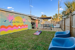 Discover playful paradise in our backyard oasis! From lively games of cornhole to creative art sessions, and cozy fireside bliss, there's something for everyone to enjoy.