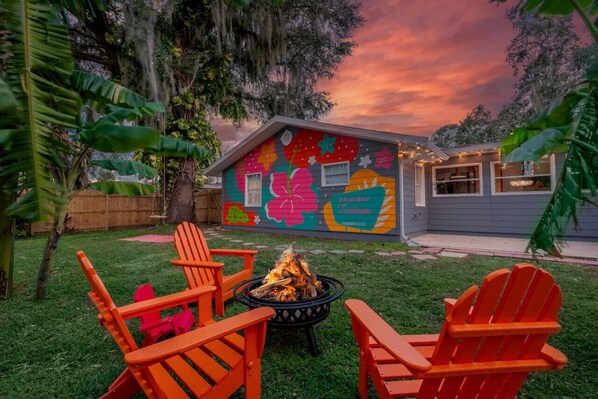 Join us for a cozy firepit evening! Bring your logs for a warm family gathering. Remember safety first. The fenced backyard offers privacy. Relax on cozy furniture under the stars.