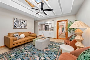 Bring the whole family to our mid-century stylish living area with an open concept that seamlessly flows into the kitchen and dining area.