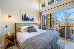 Dreamy Bedroom: Bask in natural light with stunning views and chic, nature-inspired decor!