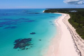 Enjoy miles of pink sand at the famous French Leave Beach.