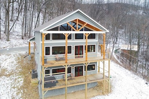 Snowy shot of the back of the cabin!