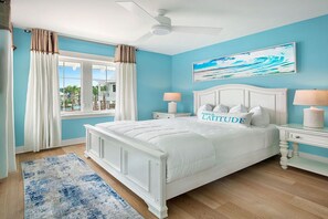 Cheerful bedroom infused with light blue hues, reflecting a tranquil beachside atmosphere.