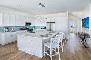 Sleek, modern kitchen with a spacious island, perfect for casual dining or morning coffee.