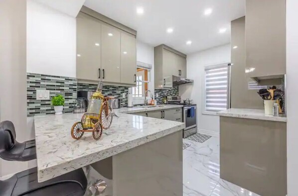 Our fully furnished kitchen with stainless steel appliances.