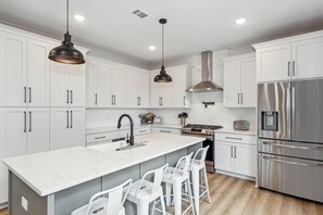 Kitchen counter bar is the ideal spot for morning breakfast or afternoon snacks