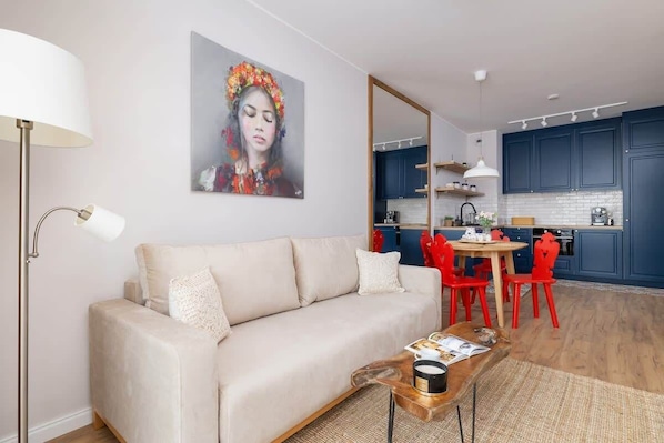 Living area with a comfortable sofa and a flat-screen Smart TV