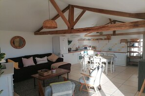 open plan kitchen,  living and dining area with pellet burner.