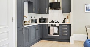 MODERN FULLY-EQUIPPED KITCHEN FOR HOME-COOKED MEALS