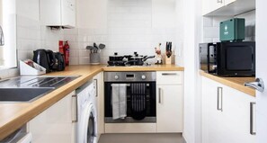FULLY-EQUIPPED KITCHEN FOR HOME-COOKED MEALS