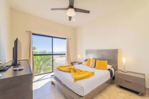 Bedroom 1 w/queen bed, ocean view, TV & ensuite bathroom (master)