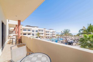 A large private terrace overlooking the pool & sea