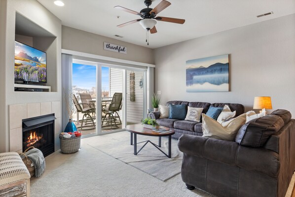 Cozy up in comfort and entertainment in the beautifully designed living room.