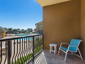 Private Balcony with Comfortable Seating and Pool View