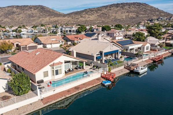 Extra long swimming pool with spa.  Paddle around the lake and catch some fish! 