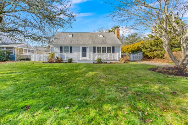 Front yard with a porch that overlooks a small bay