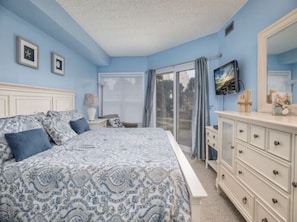 Master bedroom with tv.