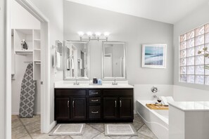Master bathroom with large walk in closet