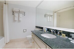Prepare your favorite meals in our sleek kitchen, complete with modern amenities.