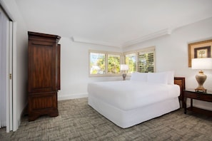 A cozy bedroom retreat with dark wood tones offering a restful night's sleep.
