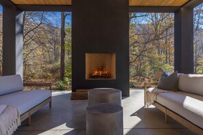 A cozy outdoor fireplace at the pavilion.