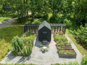 Explore the raised bed gardens and chicken coop!