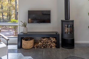 Firewood is provided for the cozy wood stove. 