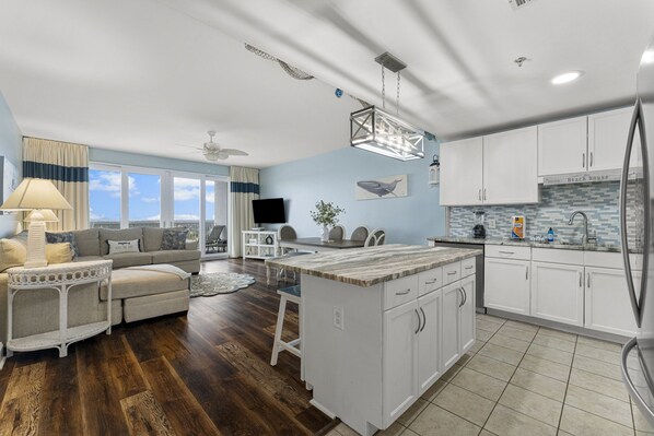 Fully Stocked Kitchen with Lake and Light Show Views and Island Bar Seating