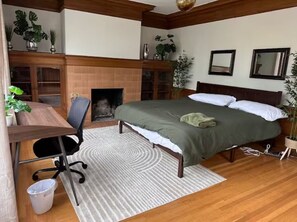 King-size bed, shelves for storing clothes, hanging space for clothes.