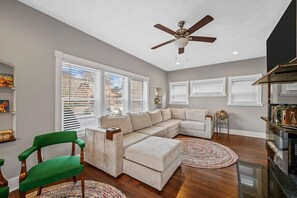 Indulge in ultimate relaxation in your living room oasis, complete with luxurious furniture and a cutting-edge flat screen TV