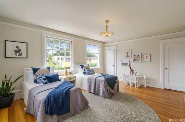 Two queen beds with luxurious, soft linens.