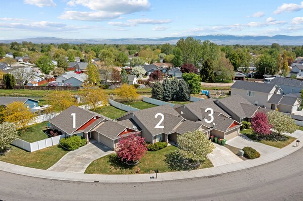 Exterior view of all three adjacent townhomes.