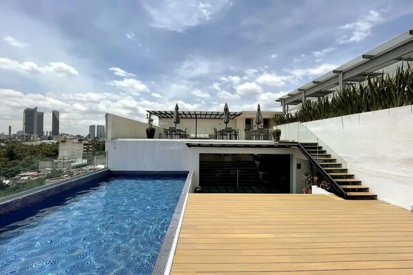 Heated pool and dining deck with stunning skyline view