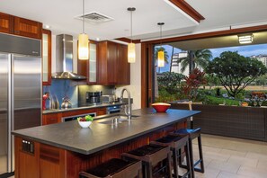 The Roy Yamaguci designed kitchen with views out of the sliding doors to the lanai.