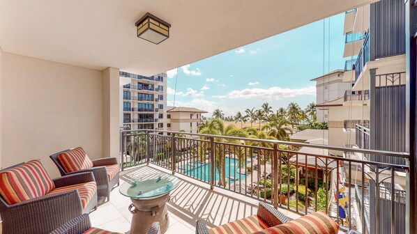 Relax on Ko Olina Beach Villas O401's lanai with breathtaking views of the pool and lush island scenery.