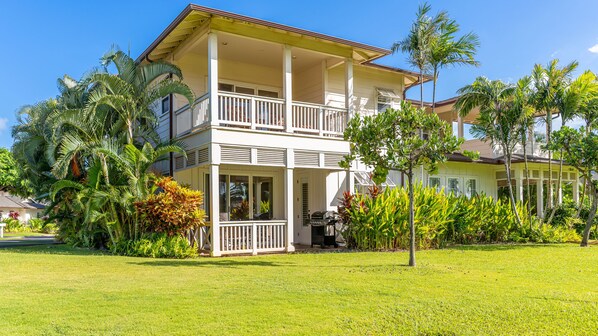 Lush palm trees and manicured gardens welcome you to this elegant villa tucked inside the Coconut Plantation community.