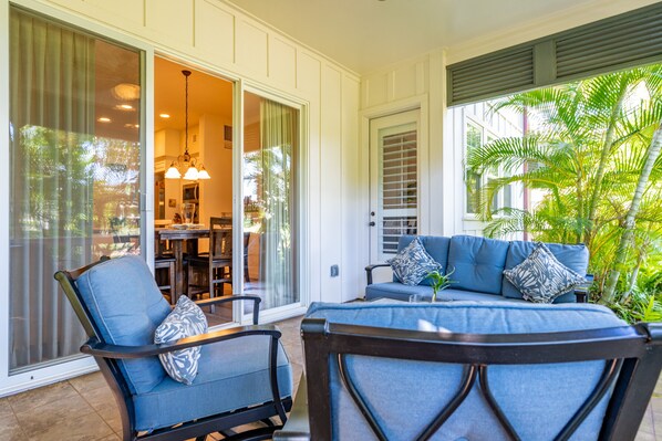 Take in the island breezes and lush greenery on the lanai.