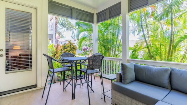 Dine al fresco on the lanai in a tropical garden atmosphere.