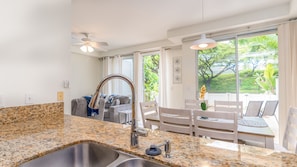 Enjoy the views of lush tropical greenery while you converse.