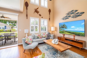 This home features high ceilings and bright colorful design.