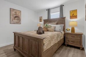 Queen bedroom with star wars theming. Private bathroom and TV.