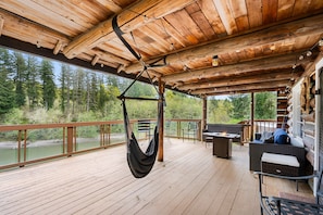 Fire table and hammock swing make the back deck fun