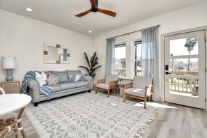 The large windows in the family room add  abundant lighting and brightness. 