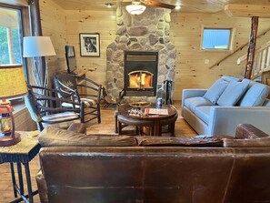 An unforgettable place to gather is in front of the wood-burning fireplace, which is surrounded by some rocks we gathered from the shoreline. Infloor heating makes the space extra cozy.