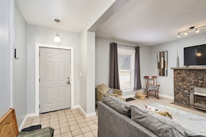 Enjoy the large front room with fireplace and Smart TV.