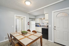 Enjoy a meal or your morning coffee around the table right off the kitchen.
