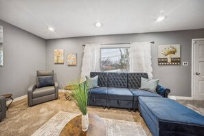 Lots of natural light from the large bay window with a view of the neighborhood.