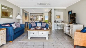 Spacious living room with water views.