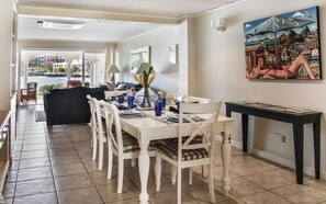 Open concept dining space, looks out to the living room and patio.